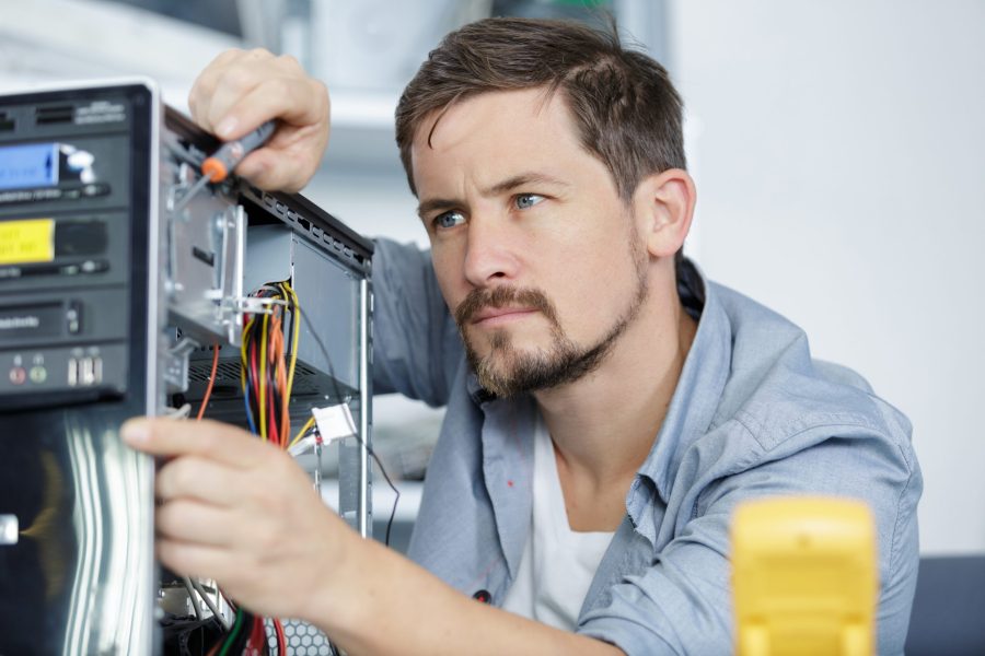 male technician repairing a computer